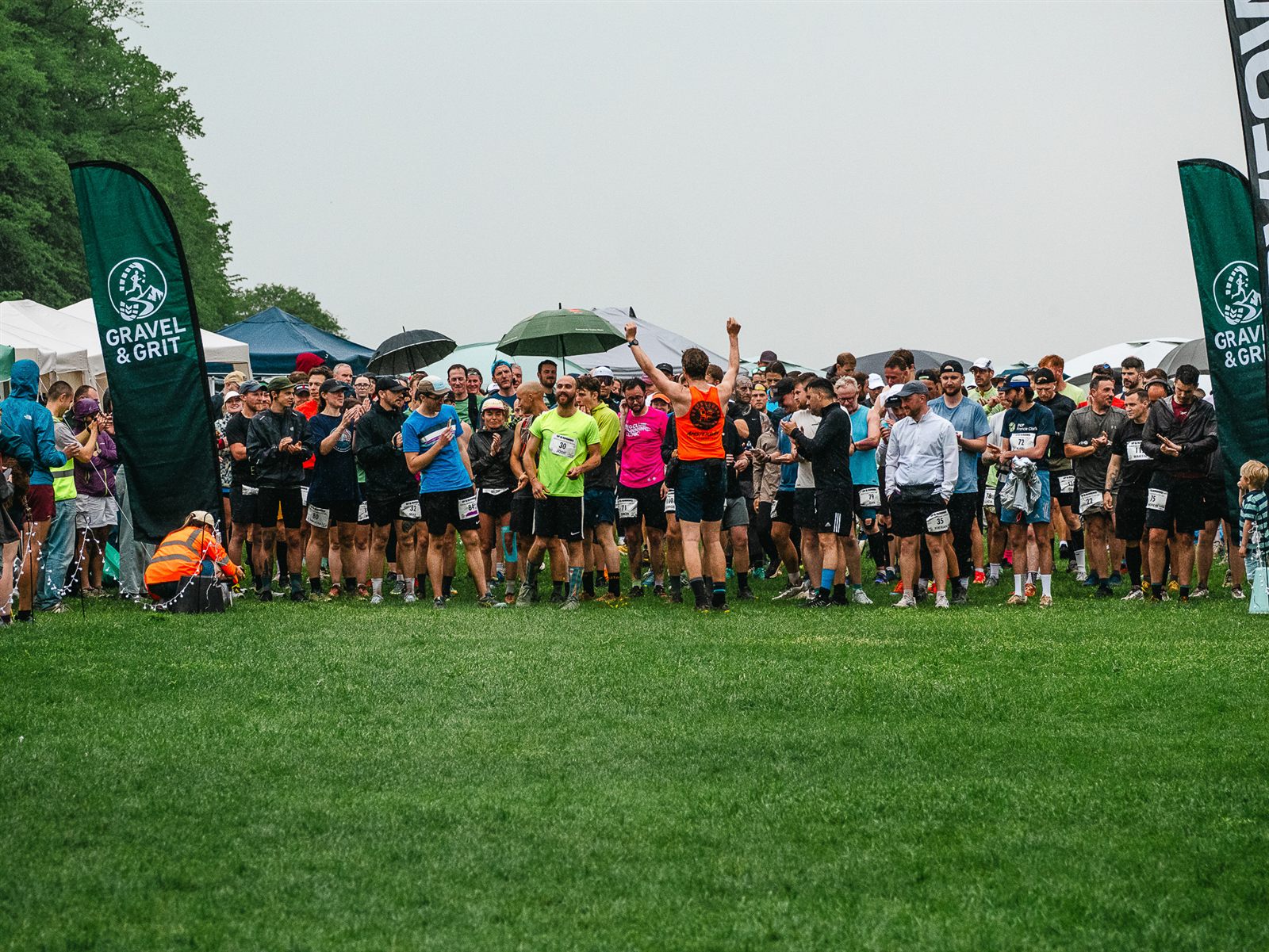 Runners gathered between Gravel and Grit flags at the Bristol Backyard Ultra 2026 start line.