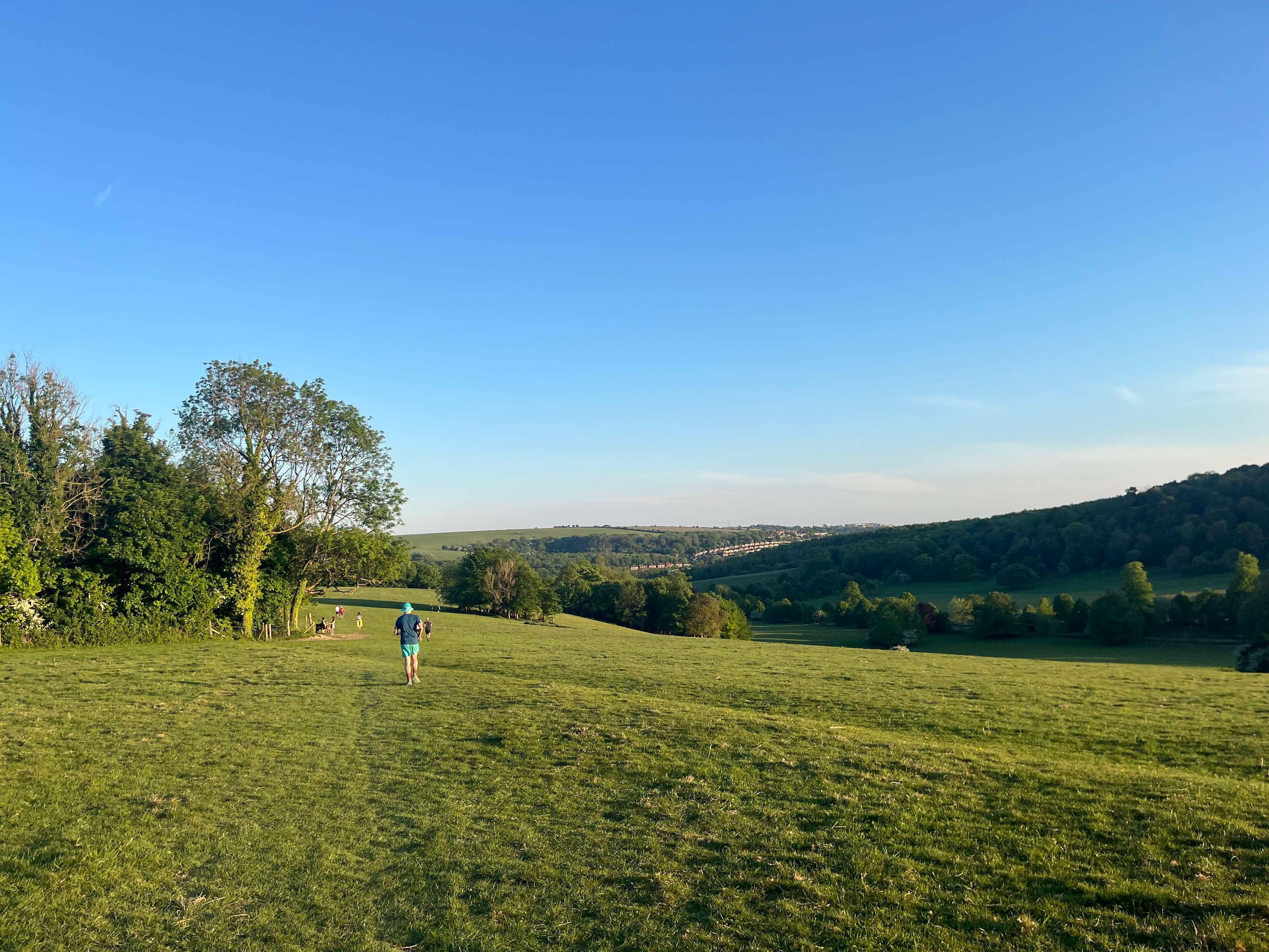 Runner in open grassy field